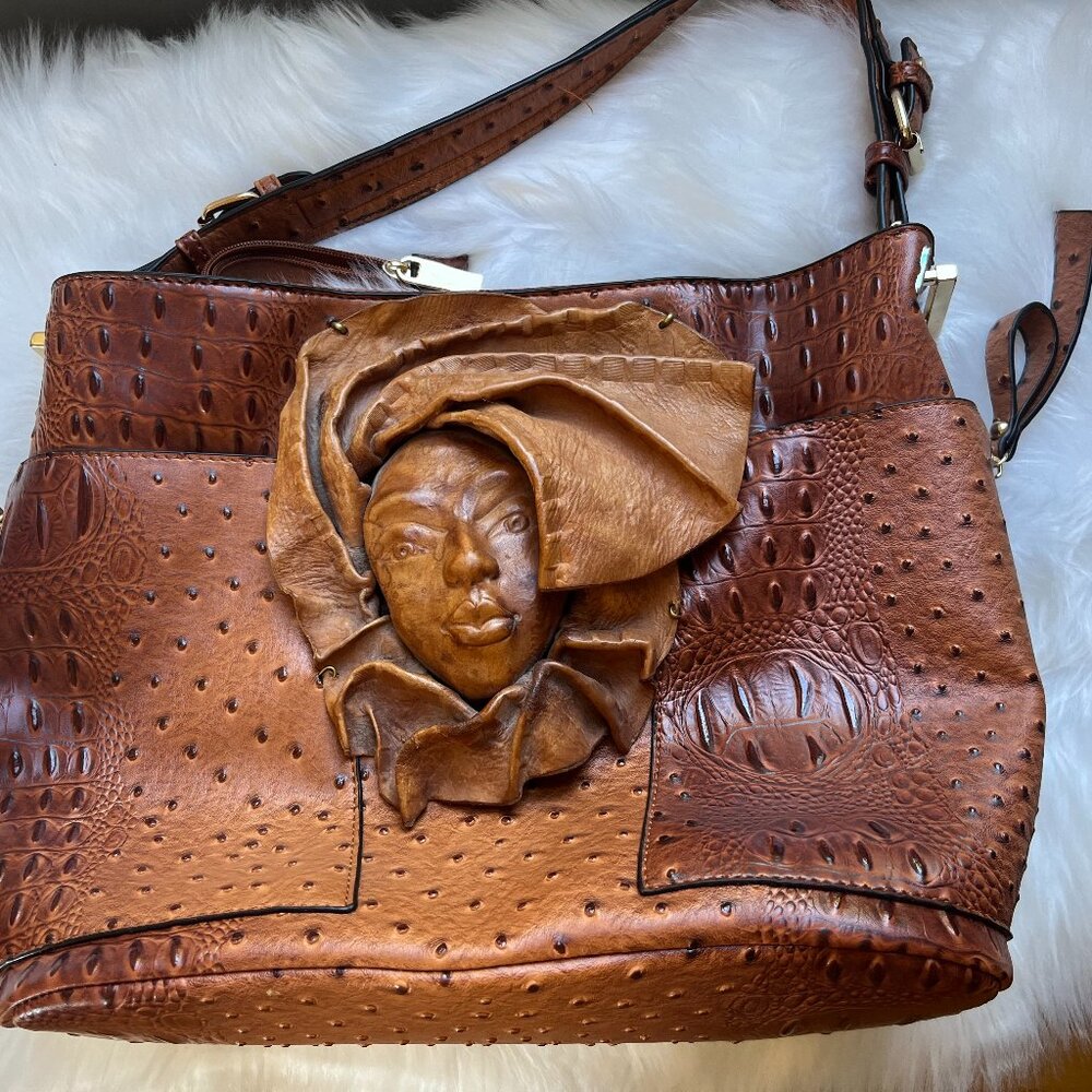 Light brown Purse, rather large and certainly unique. There are no labels.